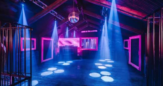 Zebra — an open arch with LED spots and a clear dance floor